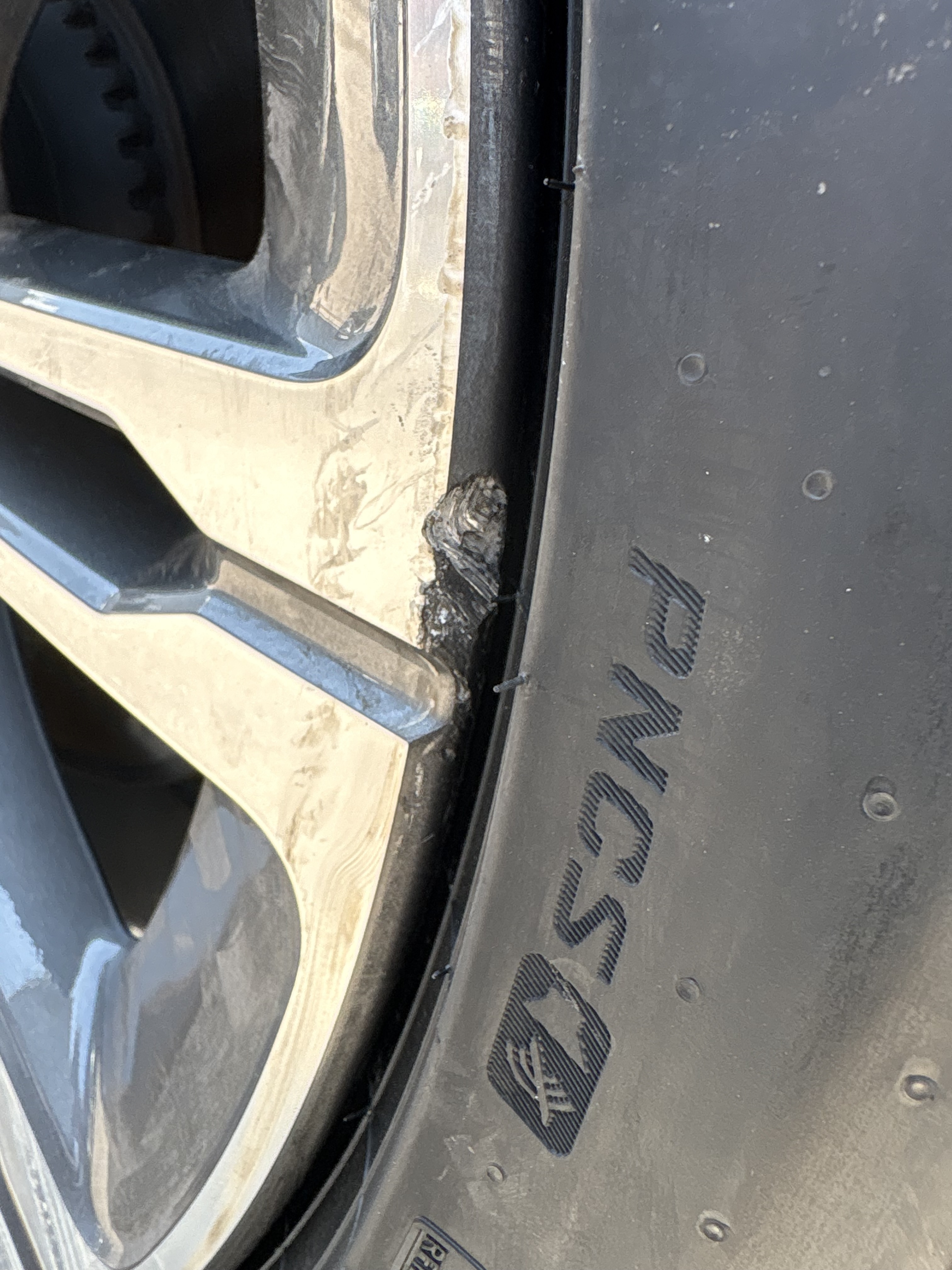 Tulsa curb damage before wheel repair
